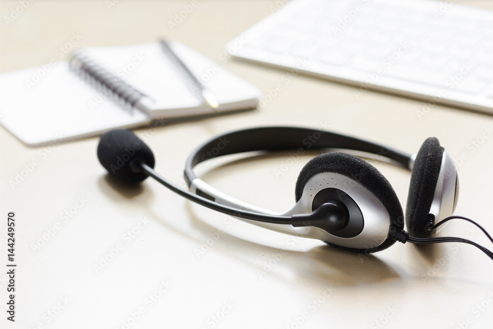 Call center support table with headset and keyboard Call center support table with headset and keyboard