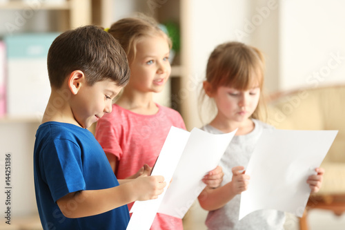 Cute kids singing in music ...