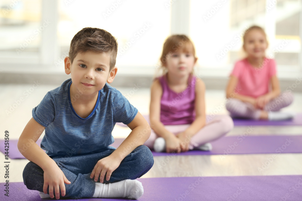 Group of children doing gymnastic exercises Group of children doing gymnastic exercises