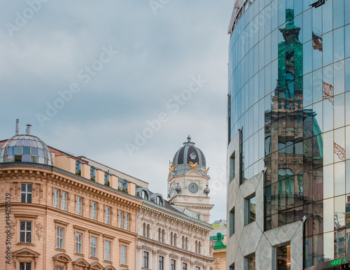 Vienna, Haas house modern glass surface  reflecting surrounding buildings photo