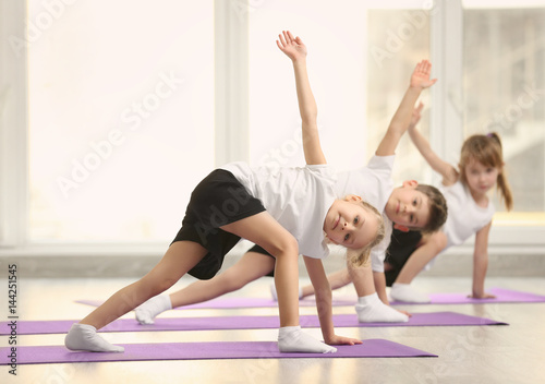 Group of children doing gymnastic exercises