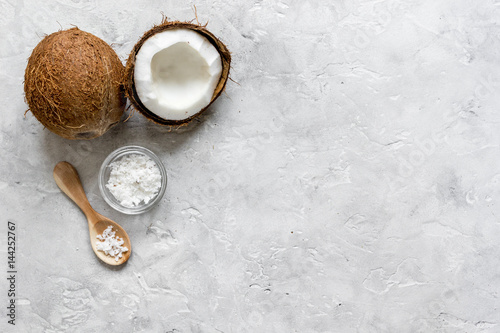 organic cosmetics with coconut on gray background top view