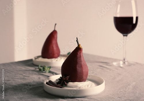 Delicious dessert with pears on table