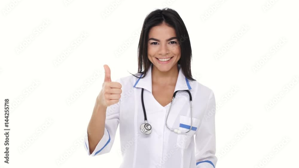 Smiling woman nurse with stethoscope showing gesture okay isolated Smiling woman nurse with stethoscope showing gesture okay isolated