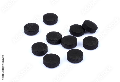activated carbon pills isolated on white background