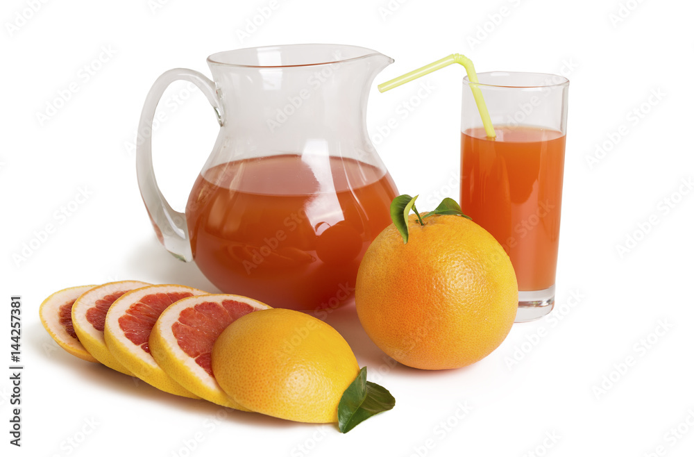 Grapefruit juice in a jug and grapefruit Grapefruit juice in a jug and grapefruit