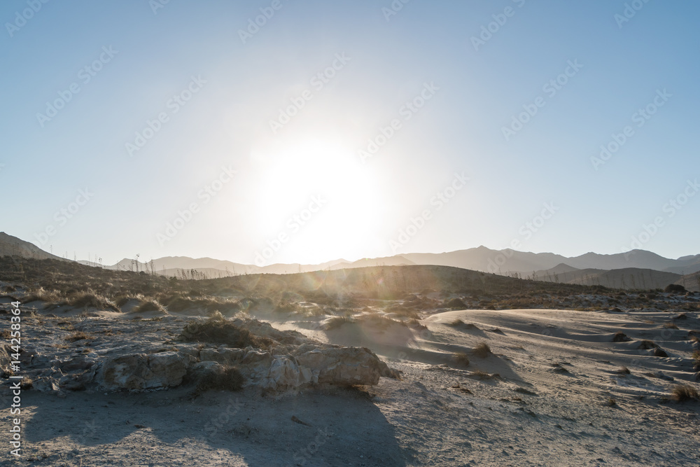 sunset over sand dunes