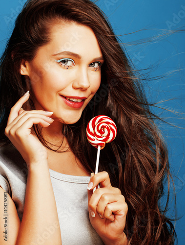young pretty adorable woman with candy close up like doll