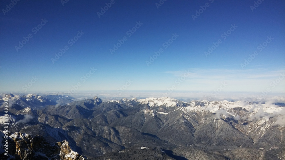 The highest point of Germany oversees many peaks of the Alps on both German and Austrian sides.