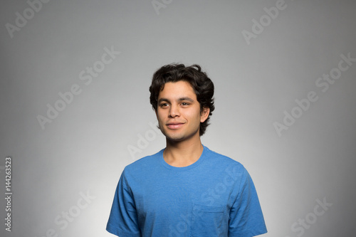 Studio portrait of a confident young man