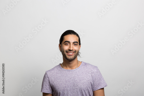Obraz na plátně Studio portrait of a smiling young man
