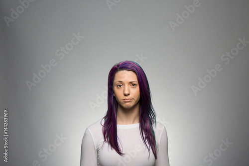 Studio portrait of a sad young woman