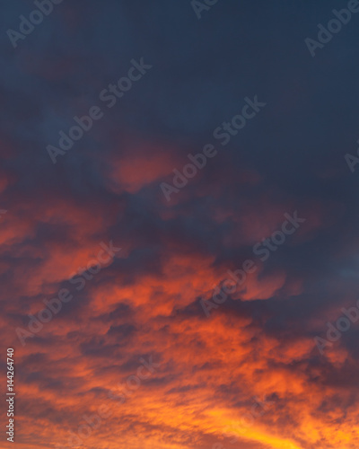 Fiery vivid sunset sky clouds © Juhku