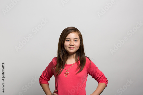 Studio portrait of a confident young girl