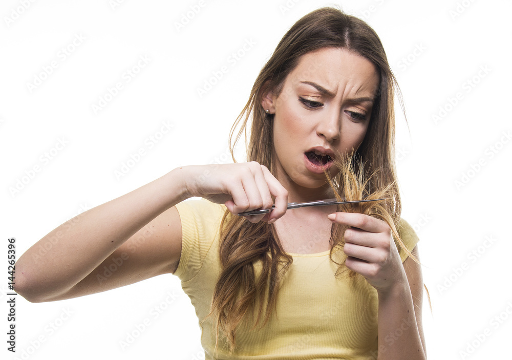 beautiful girl unhappy with her damaged and dry hair beautiful girl unhappy with her damaged and dry hair