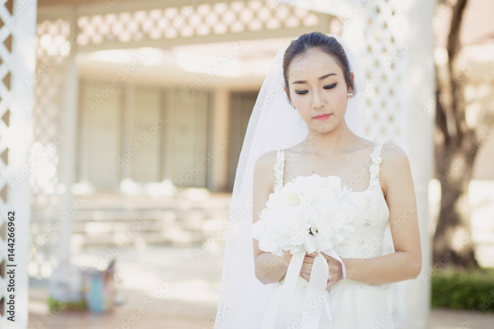 beautiful young woman on wedding day in white dress in the garden. Female portrait in the park. beautiful young woman on wedding day in white dress in the garden. Female portrait in the park.