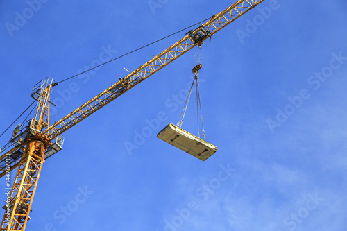 Crane over blue sky