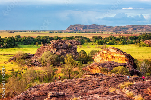 Exploring Ubirr Rock at golden hour in Kakadu National Park, NT, Australia. A superb place to get a view across the open floodplains and across Arnhem Land escarpment. photo