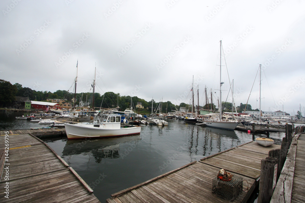 Fototapeta premium Sailboats at Dock in Camden, Maine Harbor on Cloudy Day