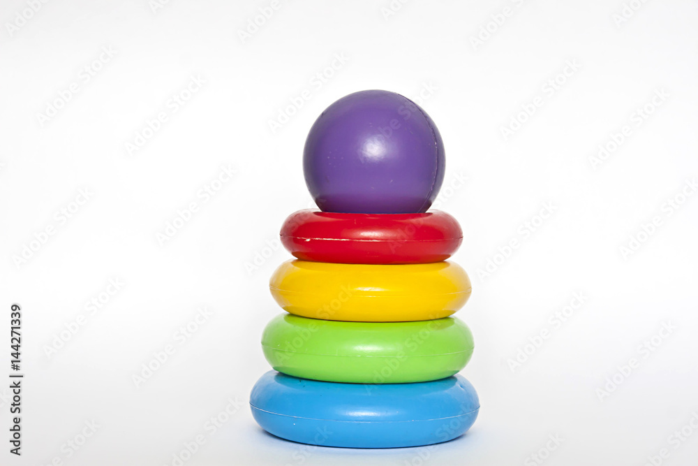 Children's educational toy, colorful pyramid on a white background Children's educational toy, colorful pyramid on a white background