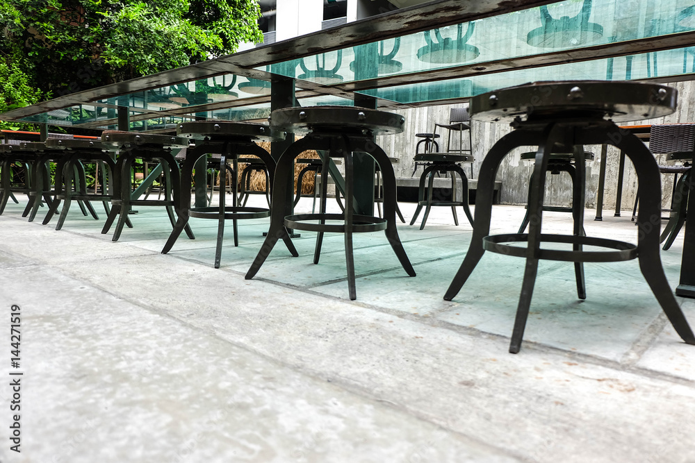 row of chairs and mirror long table in the restaurant, decor and interior concept
