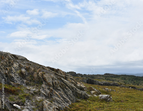 Fototapeta Naklejka Na Ścianę i Meble -  Barren rocky landscape on a bright sunny day in Newfoundland