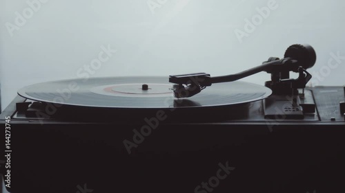 Time-lapse of an old vintage gramophone playing lp vinyl record photo