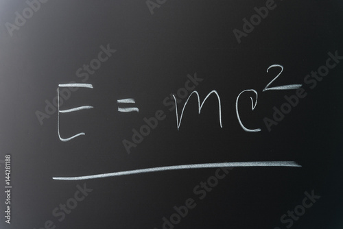 Theory of relativity formula written on chalkboard
