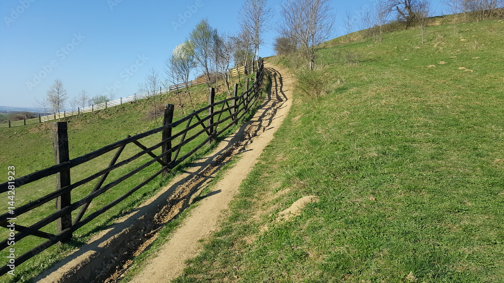 Mountain fence. Mountain rural road