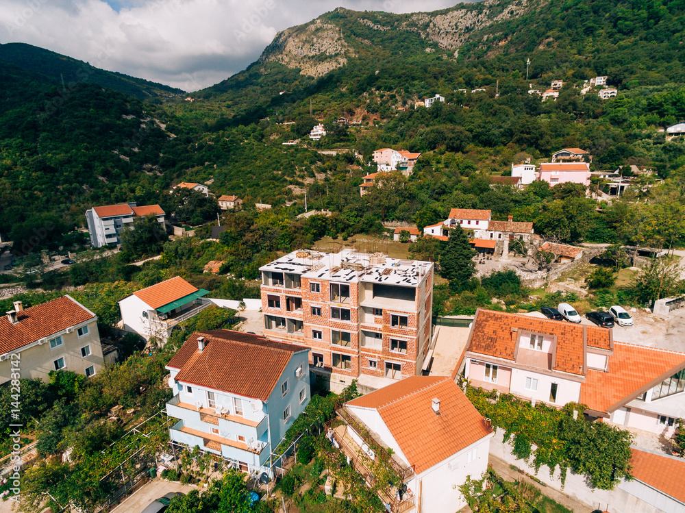 Construction of a multistory building in Budva, Podmayne district, near the monastery, Montenegro. aerial survey