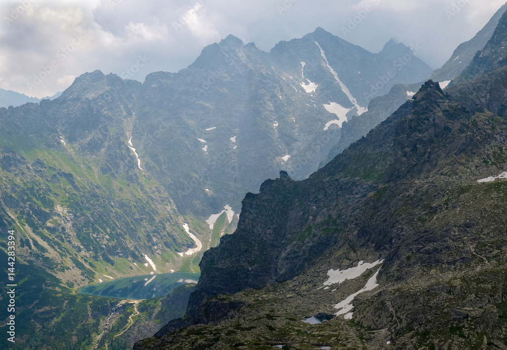 Naklejka premium View from above of the mountain lake in mountain gorge