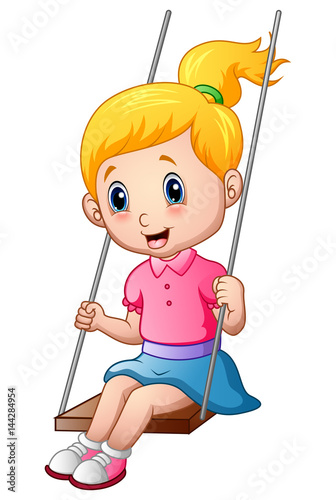 Cute little girl playing a swing