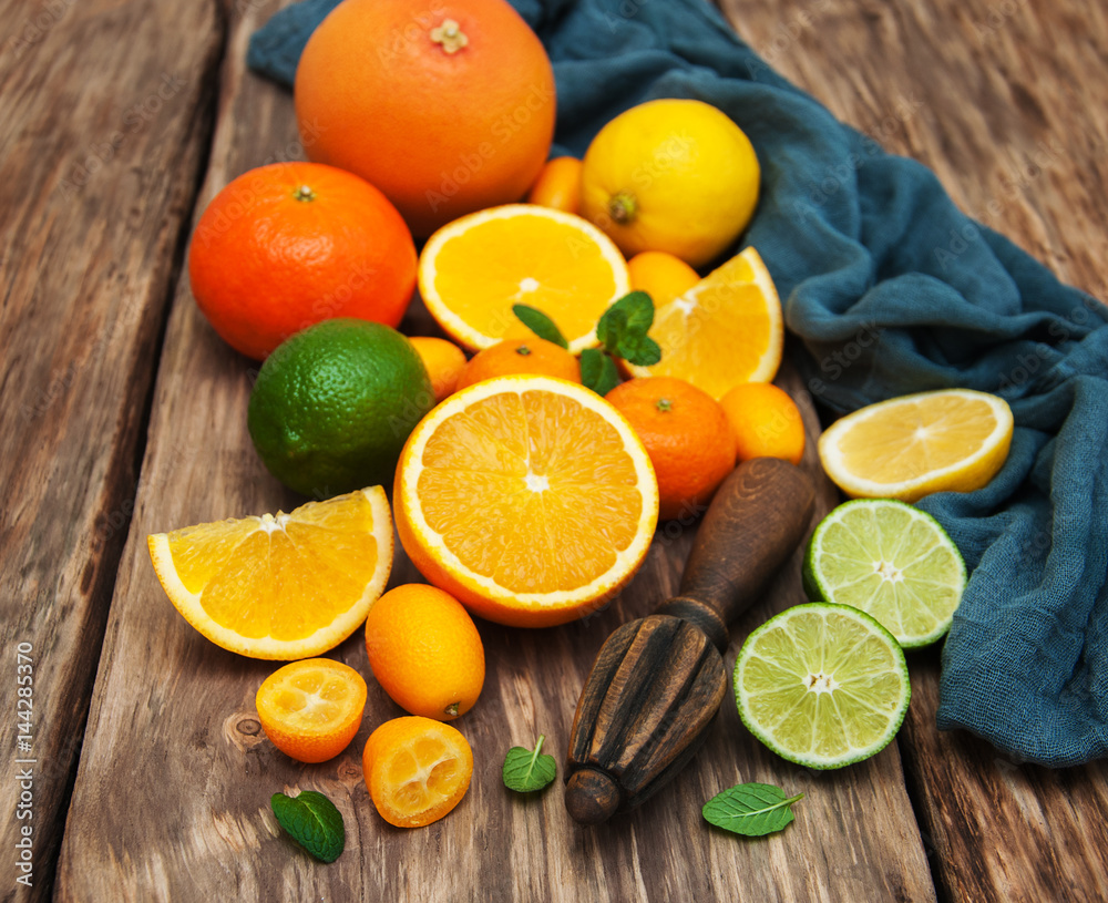 Fresh citrus fruits and old juicer Fresh citrus fruits and old juicer