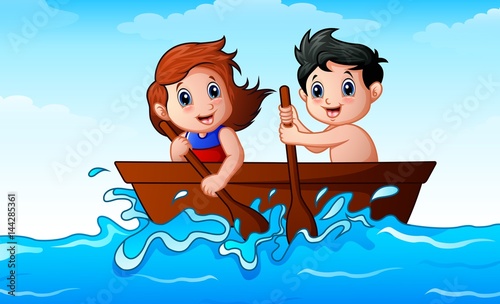 Children rowing a boat in the ocean