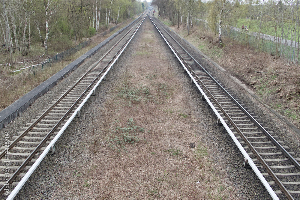 View of two train lines receding into the distance View of two train lines receding into the distance