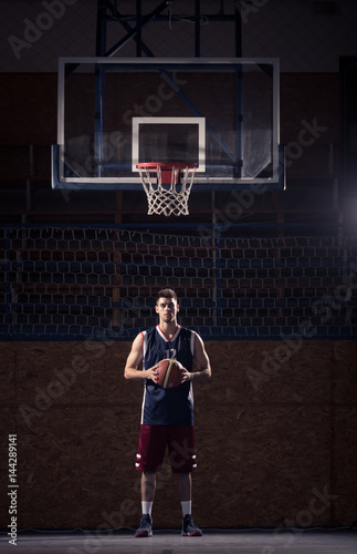 basketball player, holding ball, indoors basketball court © HD92
