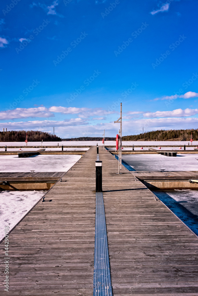 Wooden Pier On A Frozen Lake