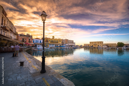 Old Venetian harbor of Rethimno at gorgeus sunset, Crete, Greece photo