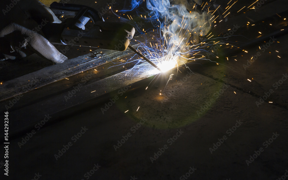 Arc welding and welding fumes at the factory welding closeup, Steel structure fabrication work.