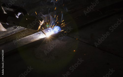 Arc welding and welding fumes at the factory welding closeup, Steel structure fabrication work.