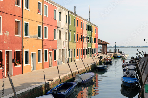 promenade of colorful houses in Burano, Venice Italy
