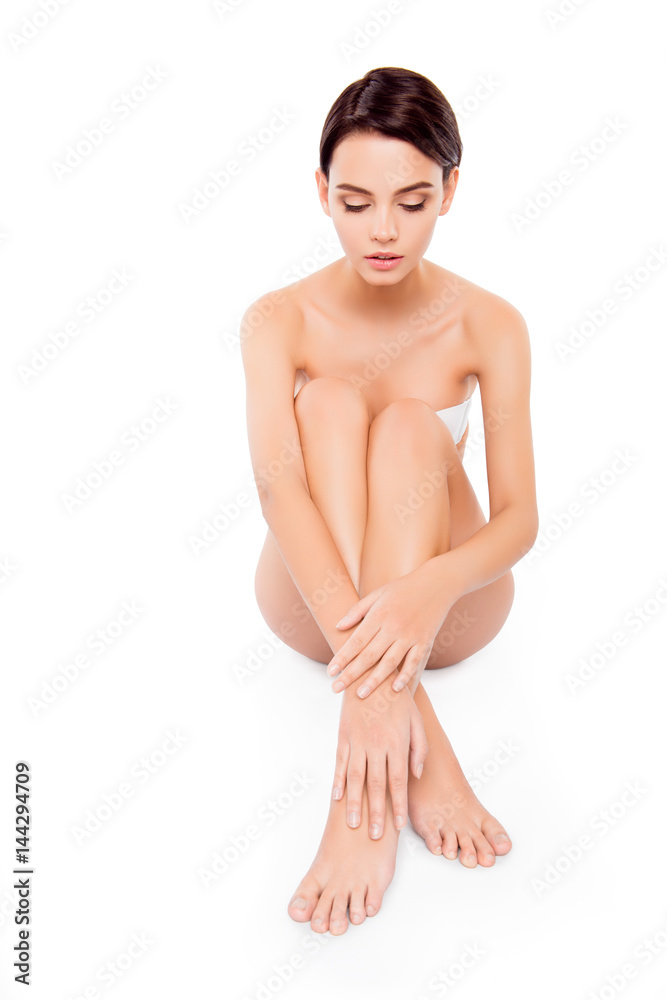 Young pretty girl sitting on the floor with mooth legs Young pretty girl sitting on the floor with mooth legs