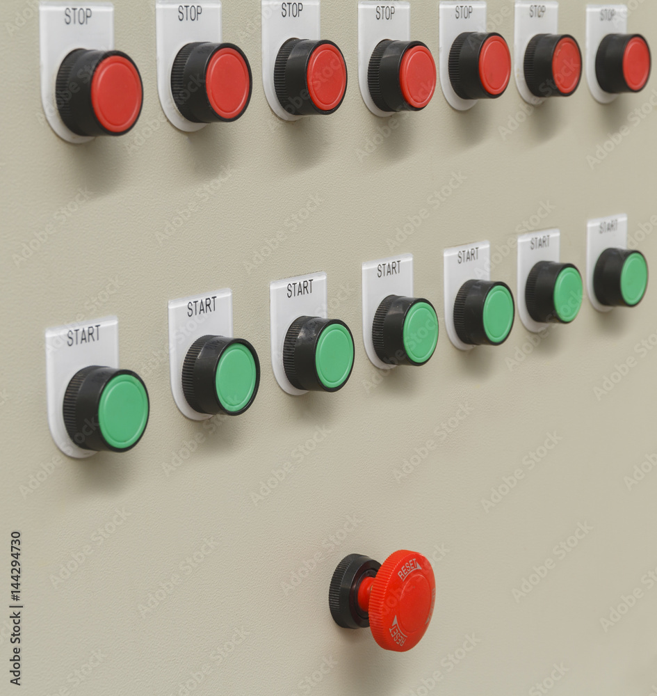 Foto de Red emergency and stop switch with green start buttons on ...