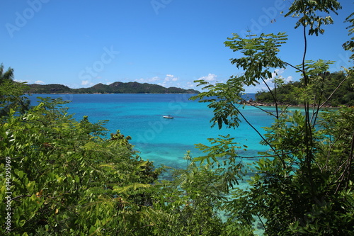 View to Anse Petite Cour and Curieuse Island which are situated in the north of Praslin Island, Seychelles, Indian Ocean, Africa © sarlay