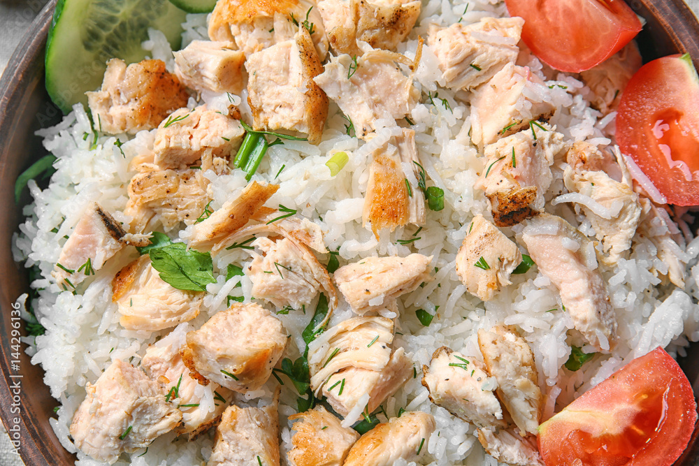 Delicious rice with chicken and vegetables, closeup Delicious rice with chicken and vegetables, closeup