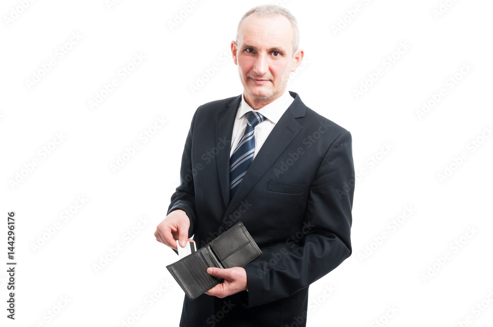 Portrait of senior showing his credit card in wallet Portrait of senior showing his credit card in wallet