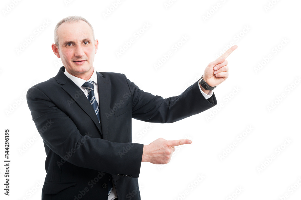 Portrait of elegant senior pointing advertising area Portrait of elegant senior pointing advertising area