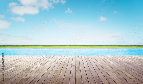 Empty wooden deck with swimming pool © jamesteohart
