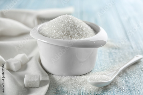 White sand sugar in bowl on table