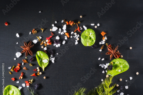 Frame of Spinach, greens,  spices on chalkboard